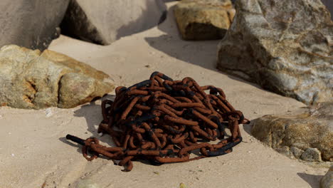 old-rusted-chain-in-the-sand